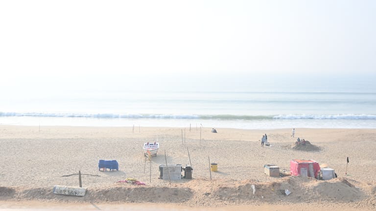 Puri Beach over the hotel's balcony railing