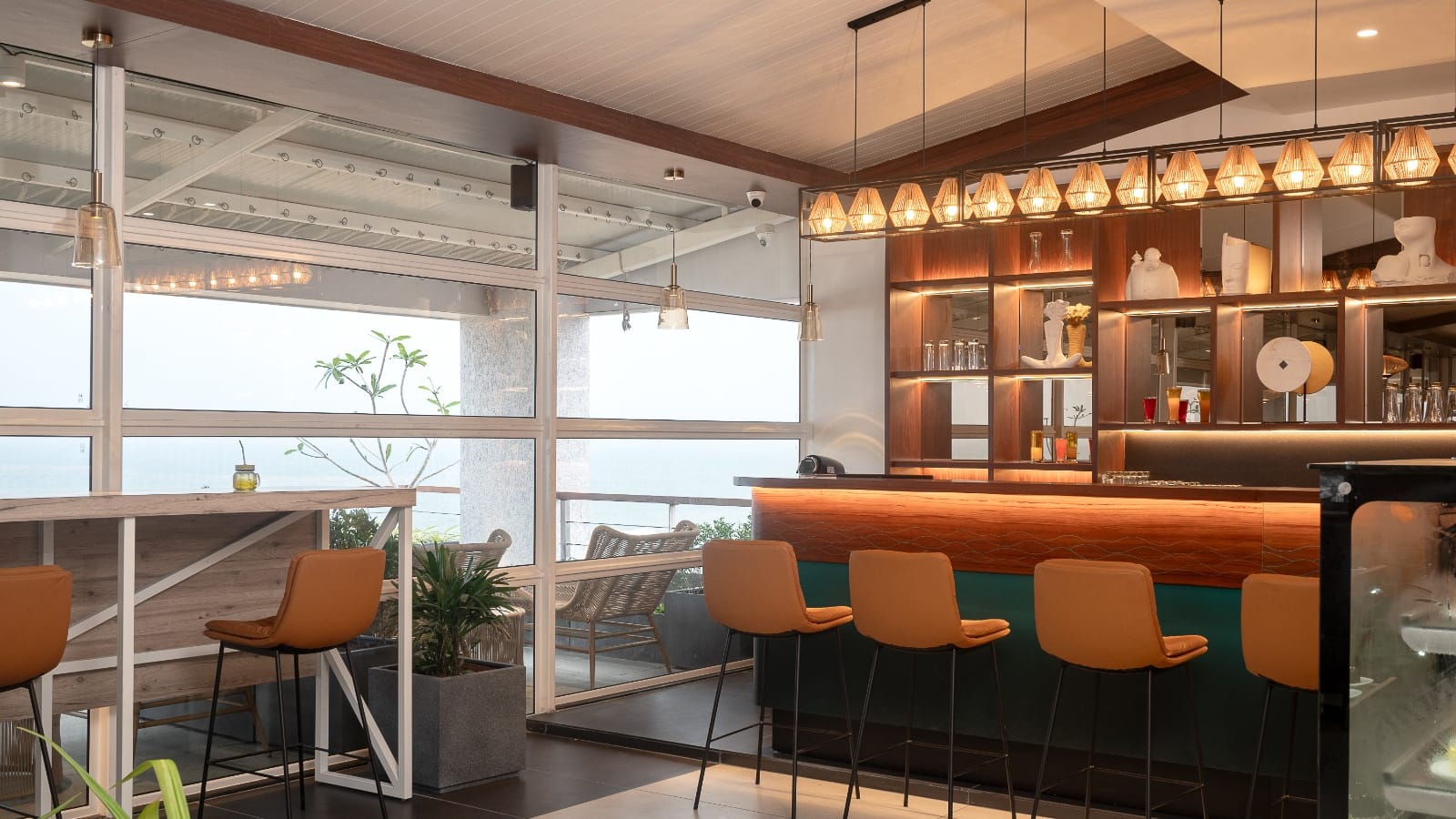 Bar counter with orange stools at the Sundowner Cafe