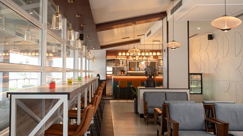Cafe seating with grey-blue armchairs