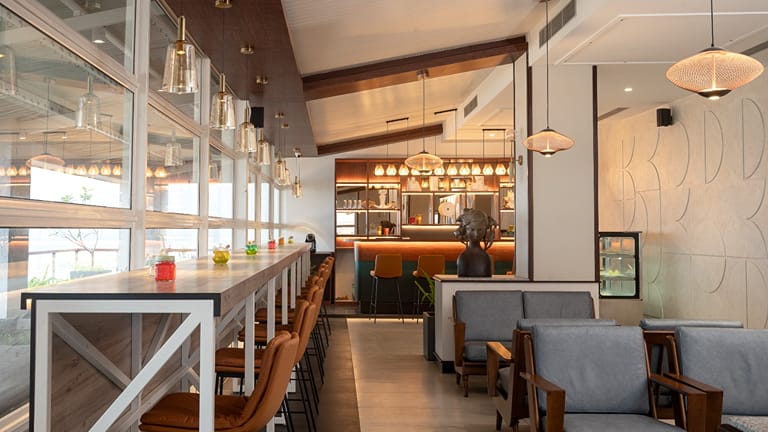 Cafe seating with grey-blue armchairs