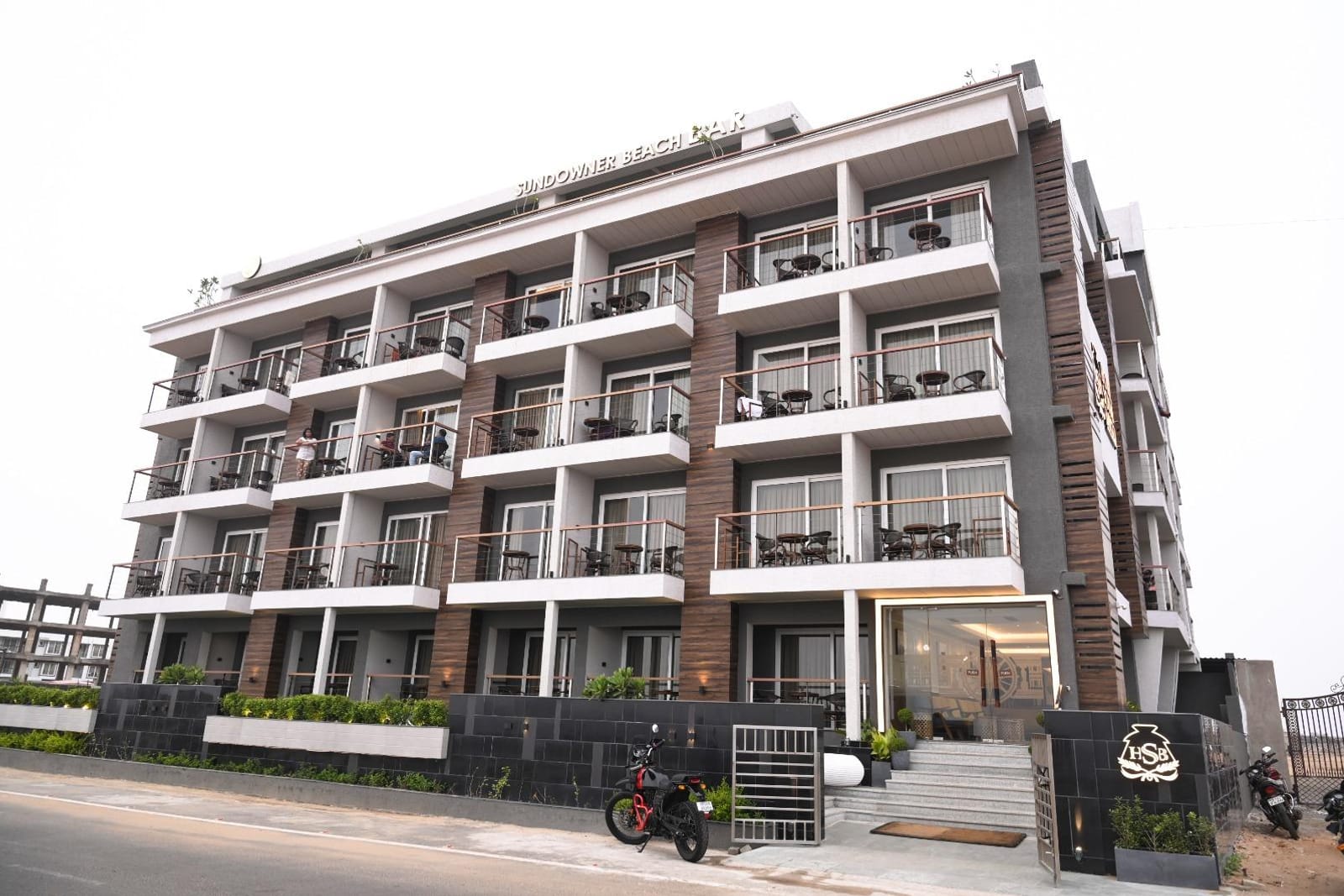 A wide view of the hotel facade and its grounds from the Marine Drive side