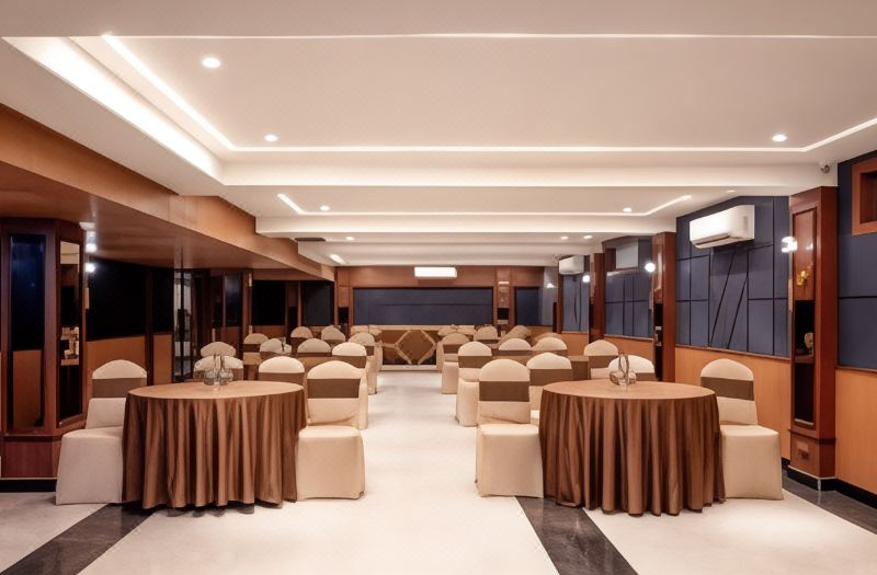 Conference layout in the banquet hall, with chairs arranged around tables