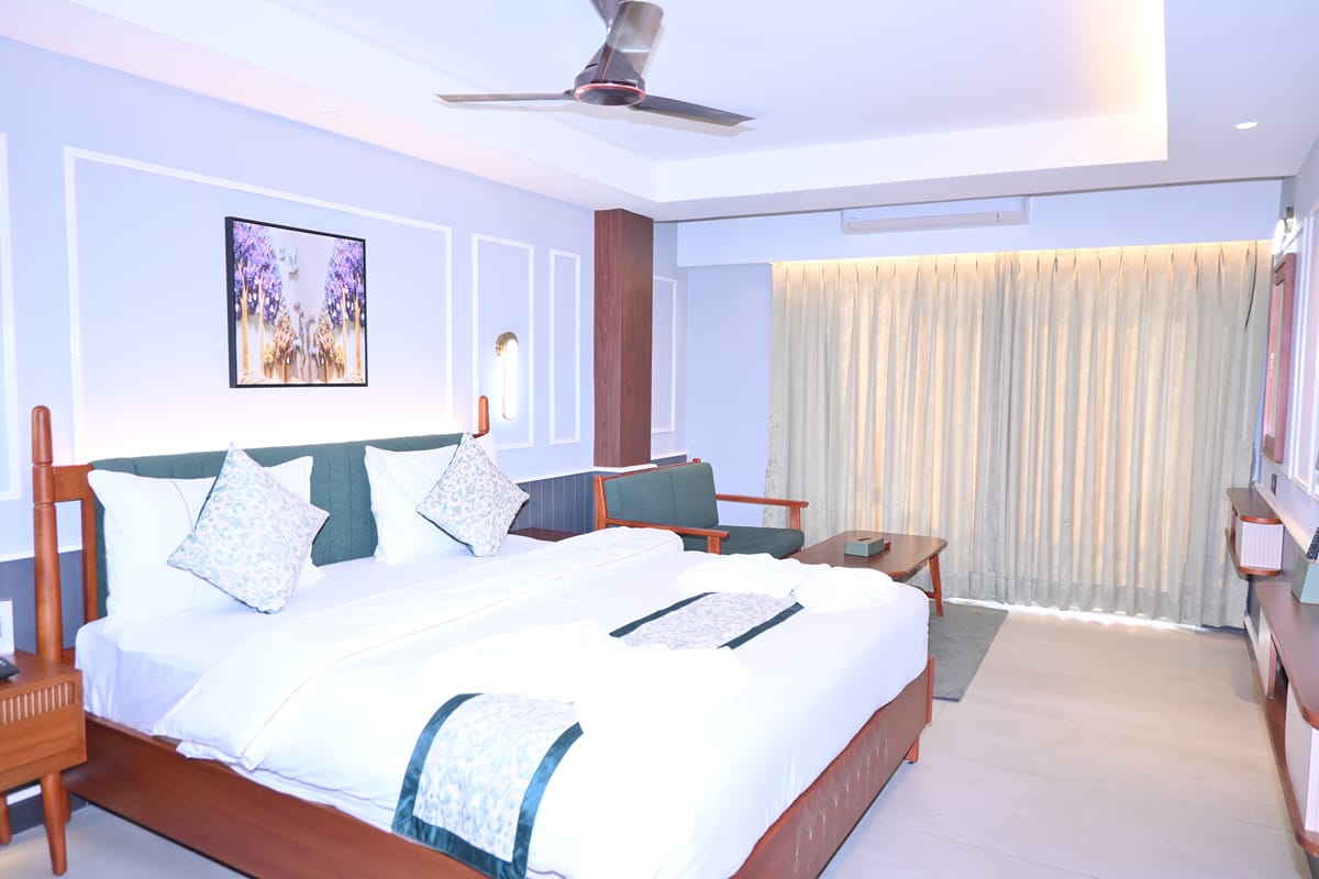 Platinum Double — king bed with a sliding door to the balcony