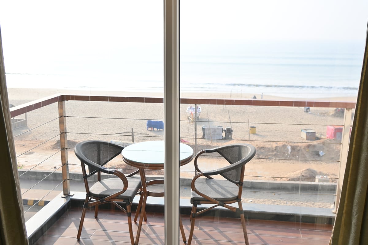 View from the Platinum Double balcony over sand and sea at Puri
