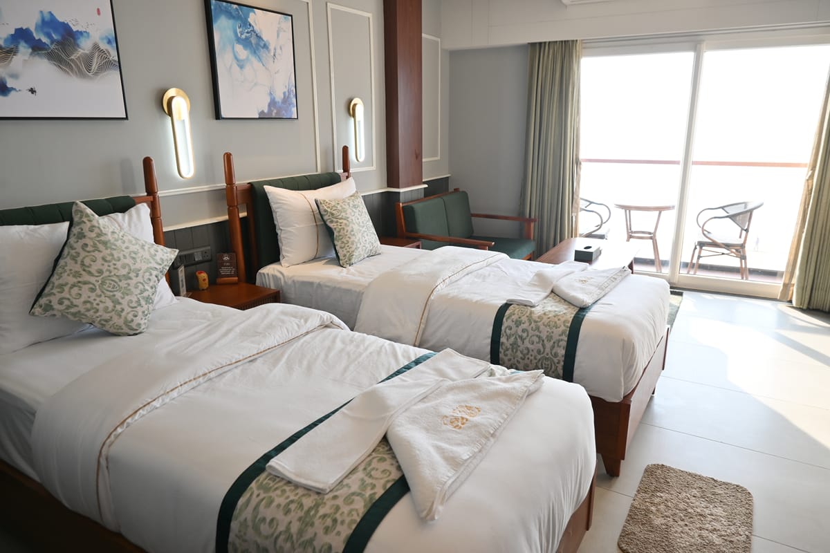 Platinum Twin Bed — sliding glass door opening onto the balcony